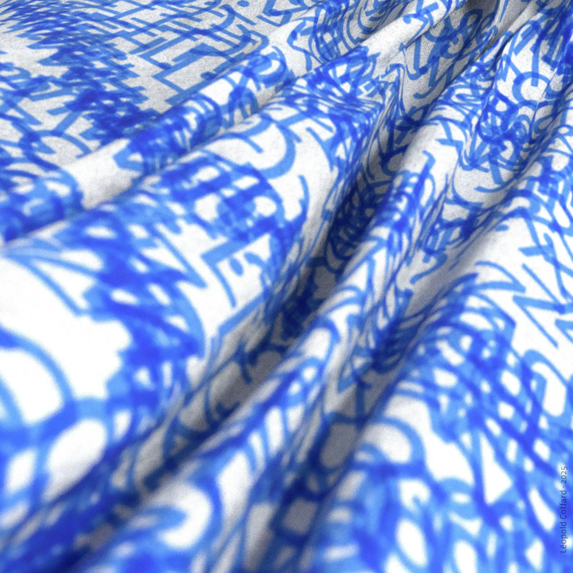 Close-up of white fabric draped with an abstract blue pattern resembling letters and shapes.