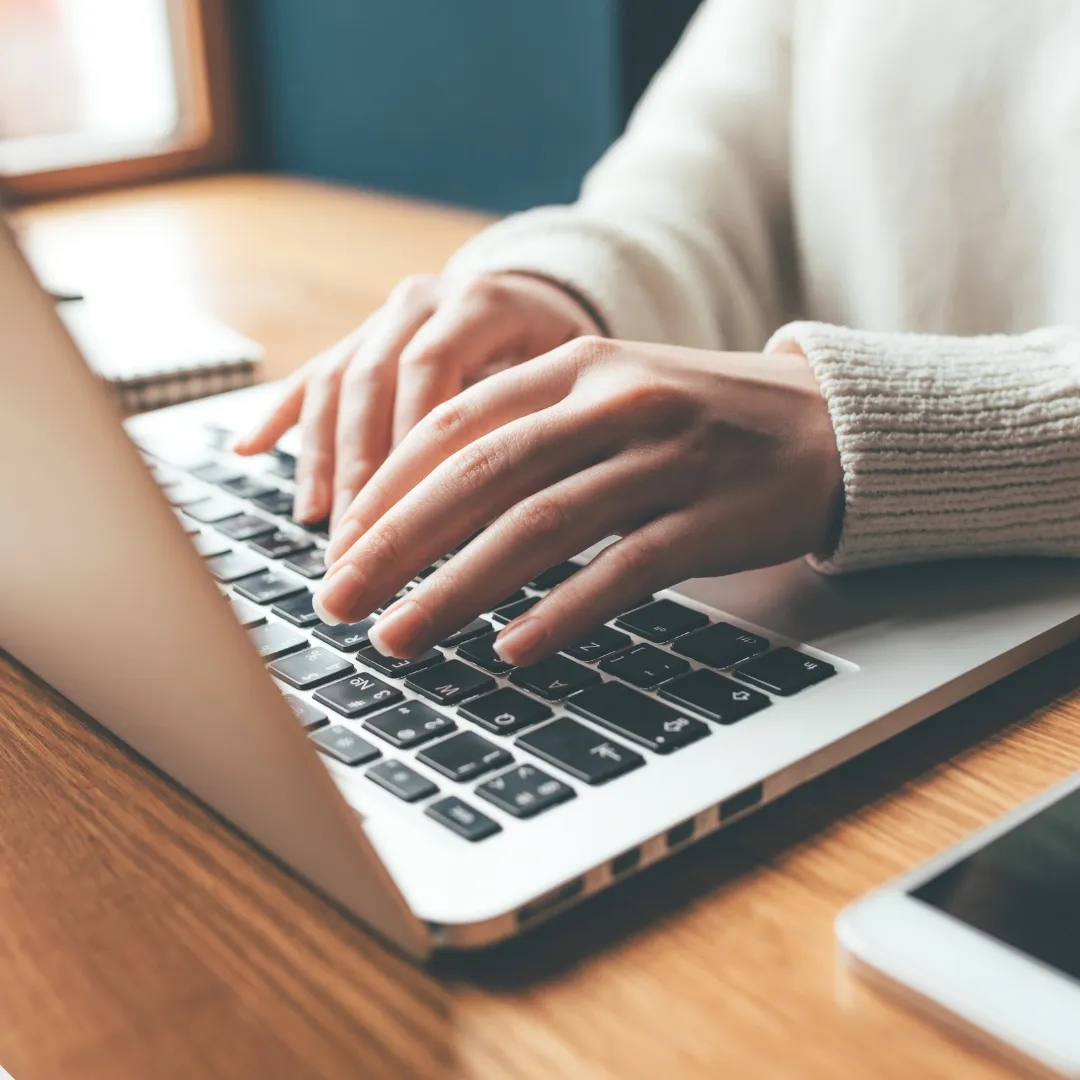 Hands on a laptop 