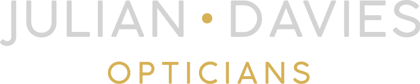Julian Davies Opticians logo in gray and yellow typography