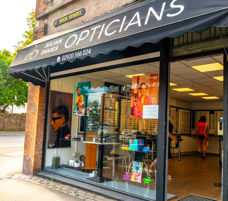 Julian Davies Opticians storefront with colorful eyewear displays and glass windows