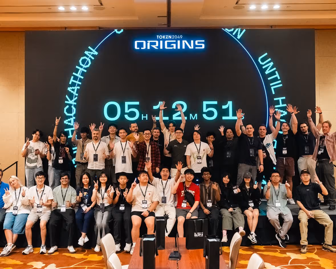 TOKEN2049 group photo of participants in Singapore with excited team pose