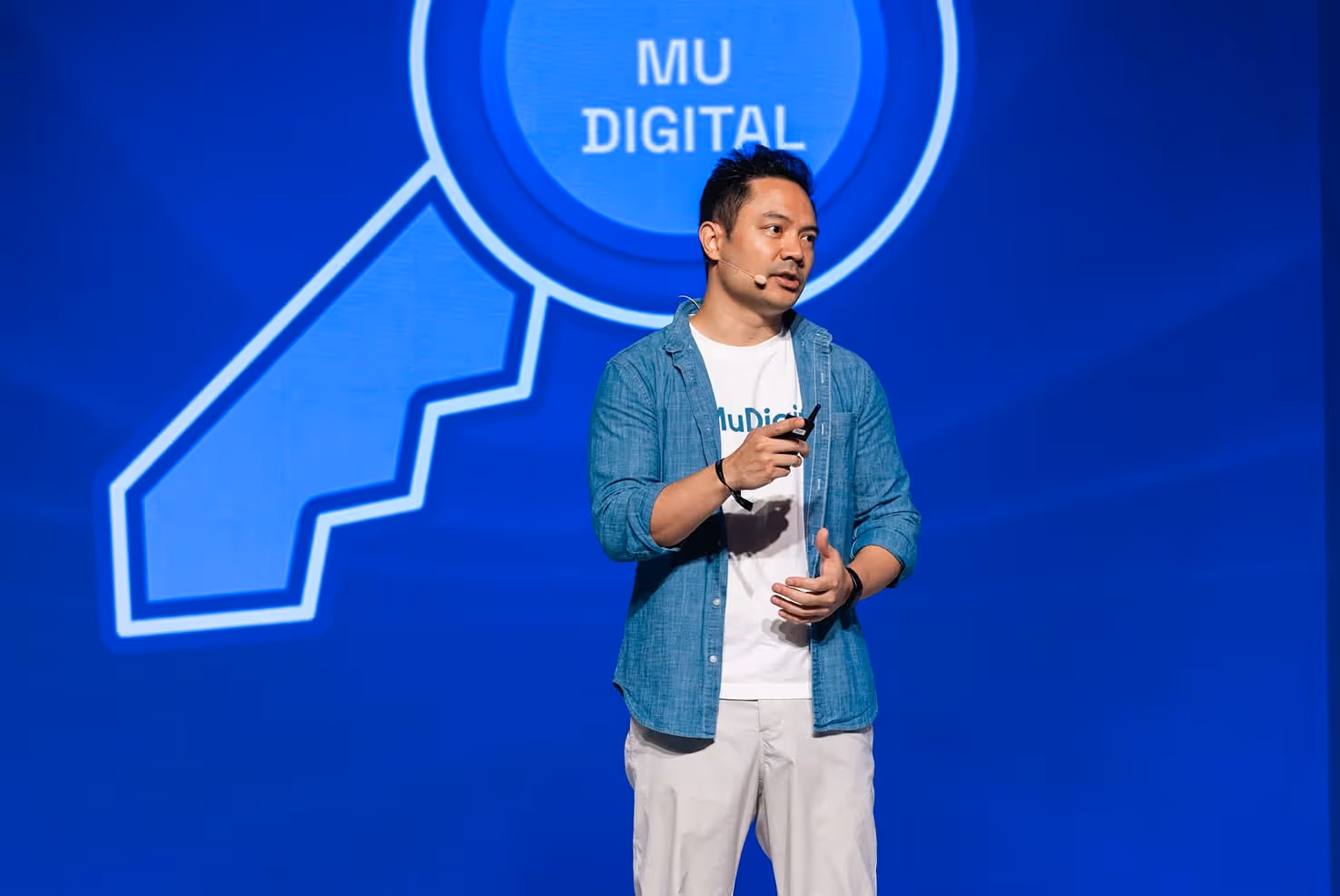 Speaker presenting Mu Digital at TOKEN2049 conference in Singapore