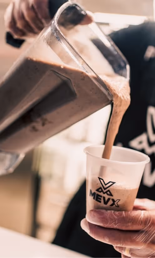 Fresh protein shake being poured at TOKEN2049 Dubai" title="Fresh Protein Shakes