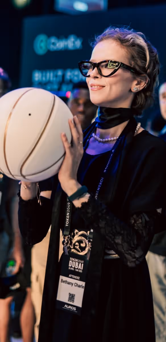 Attendee holding a basketball during a side quest