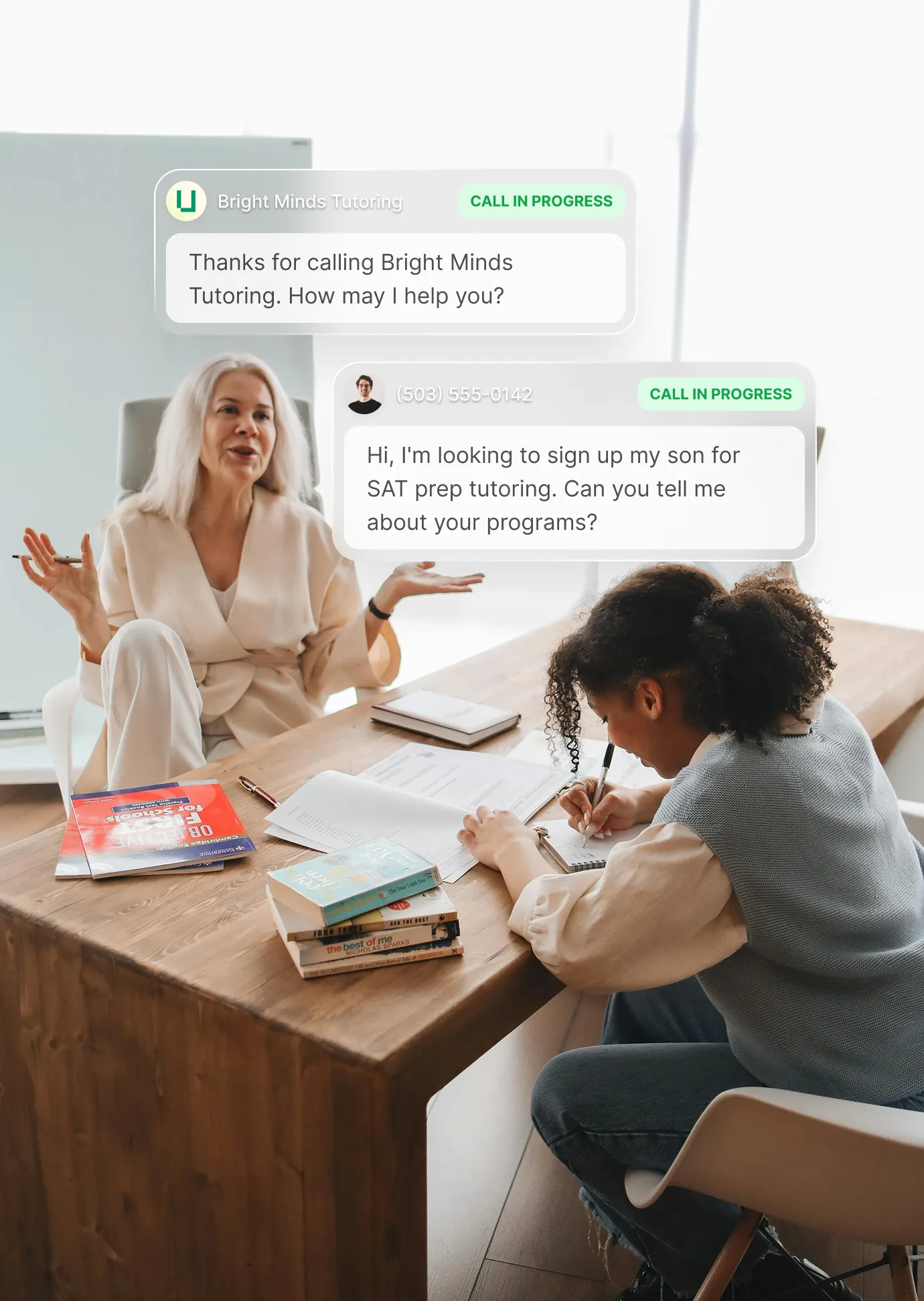 A photo of a tutor and her student sitting around on a desk learning subjects while a tutoring answering service answers a question about SAT prep tutoring.