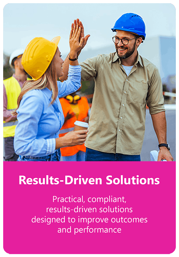 two people in hard hats giving each other a high five