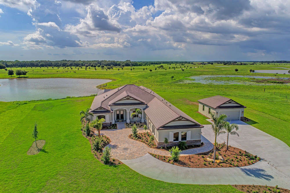 A Medallion home in the Hampton Lakes community of Sarasota, Florida, is surrounded by acres of green.