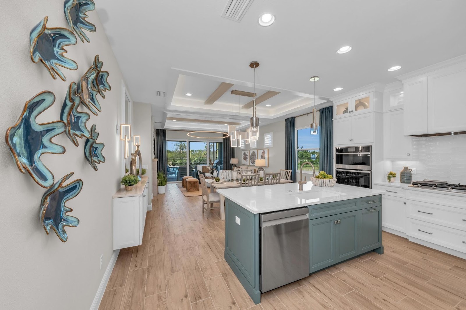 Fully furnished kitchen and living room of the Boca Grande 2 floorplan by Medallion Home