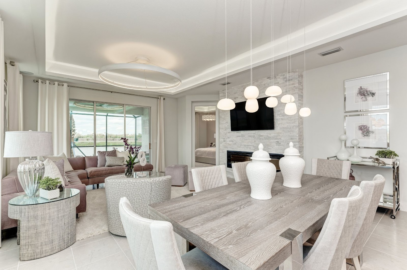 Interior of Medallion Home Boca Grande 2 model home dining room and living room.