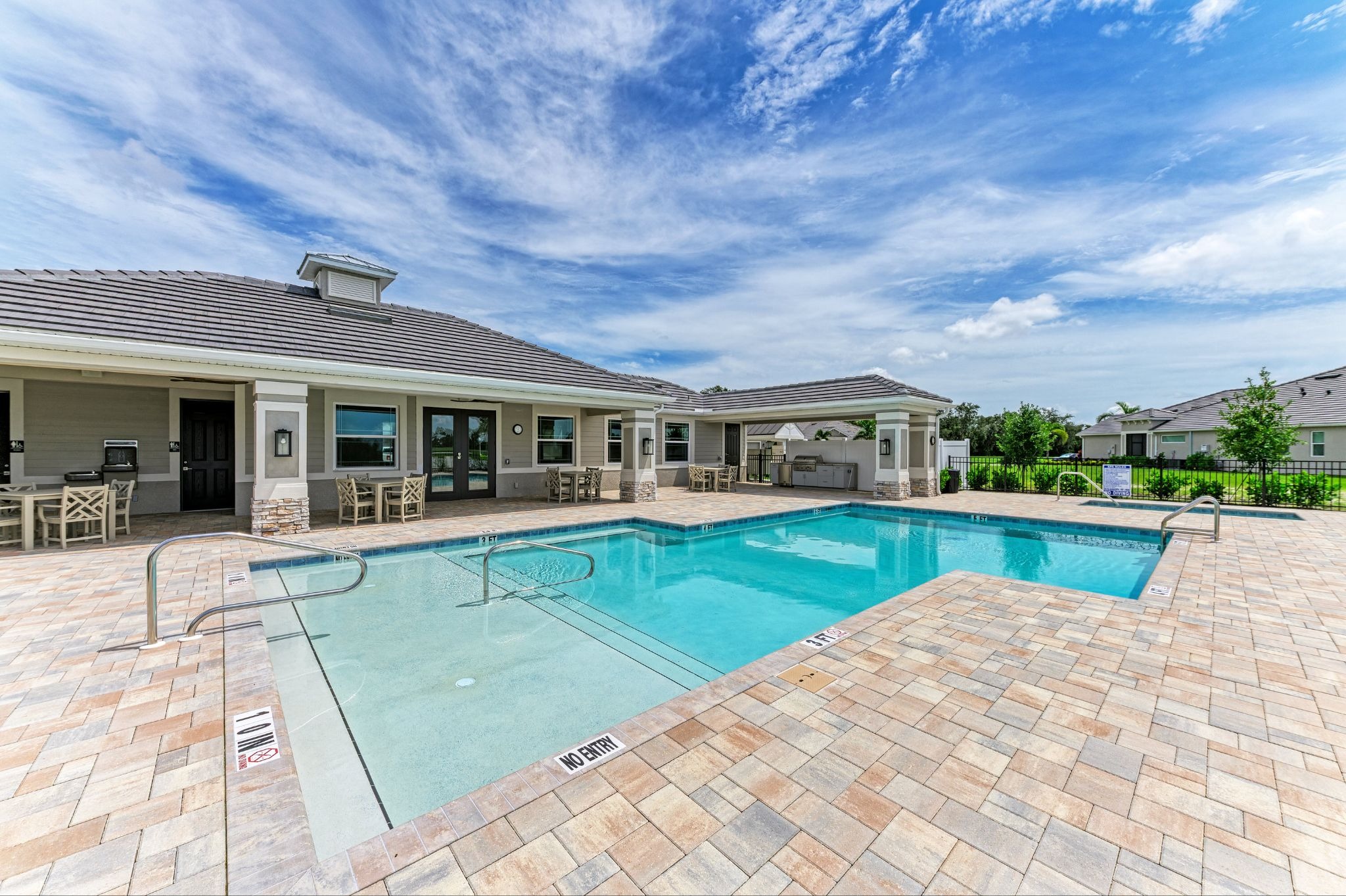 Outdoor pool and amenity center at The Laurels by Medallion Home
