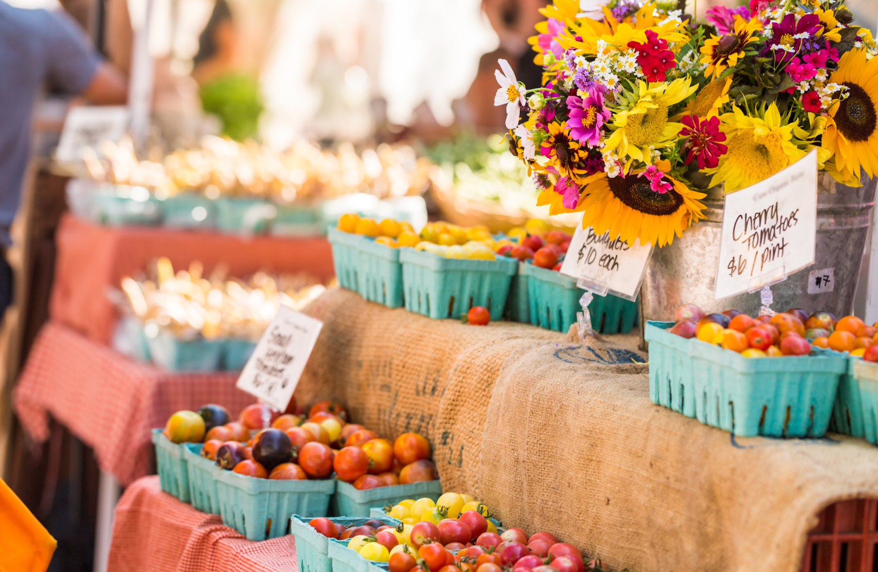 Flowers and fresh produce at a farm stand