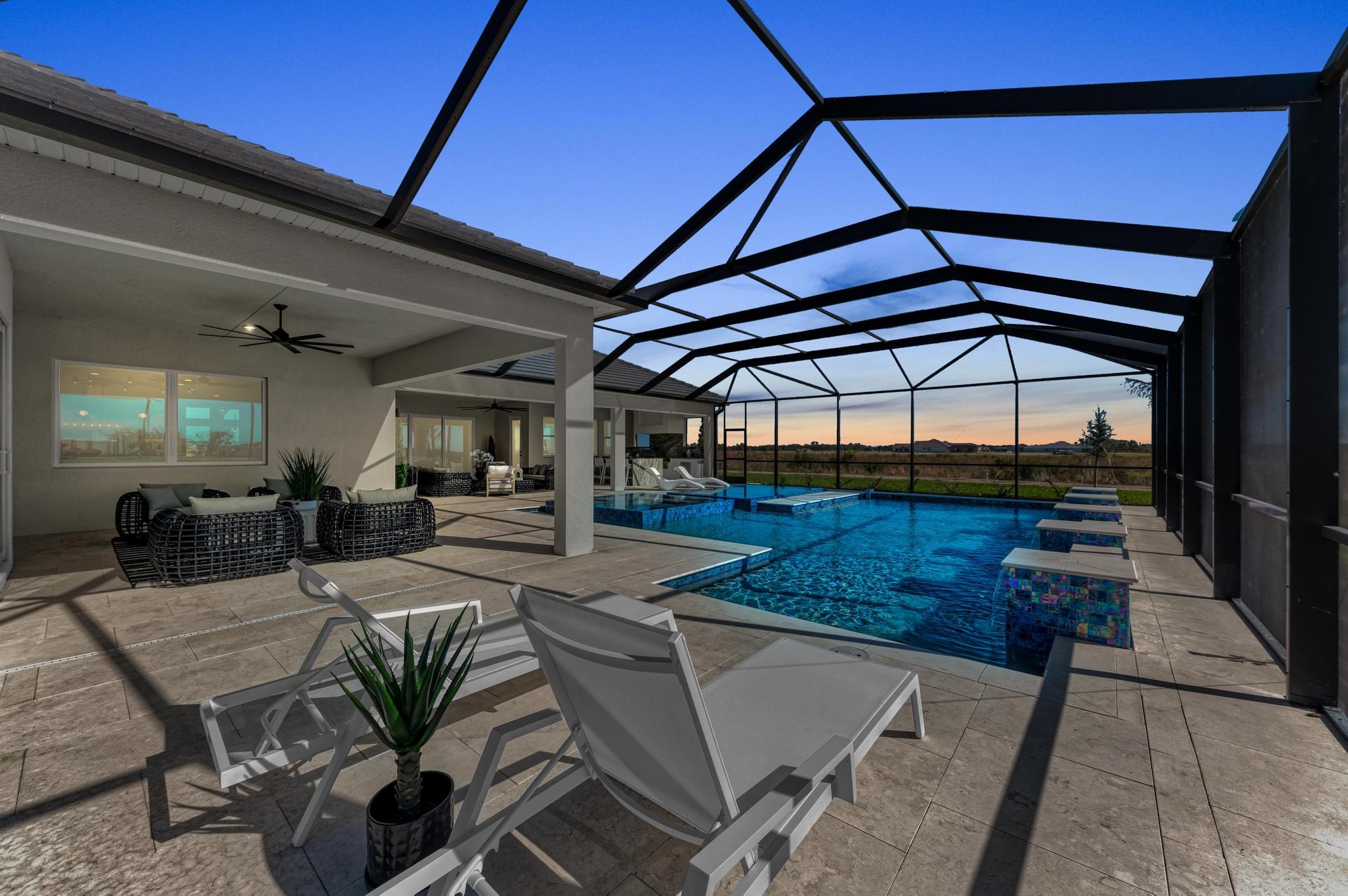 Spacious Medallion Home enclosed lanai at sunset.