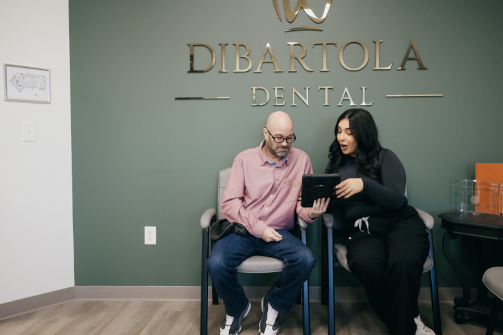 Male patient with dentist in DiBartola Dental office waiting area