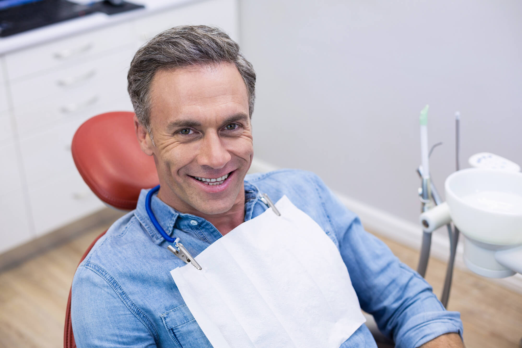 middle aged man smiling after Same-day smiles Summerfield FL