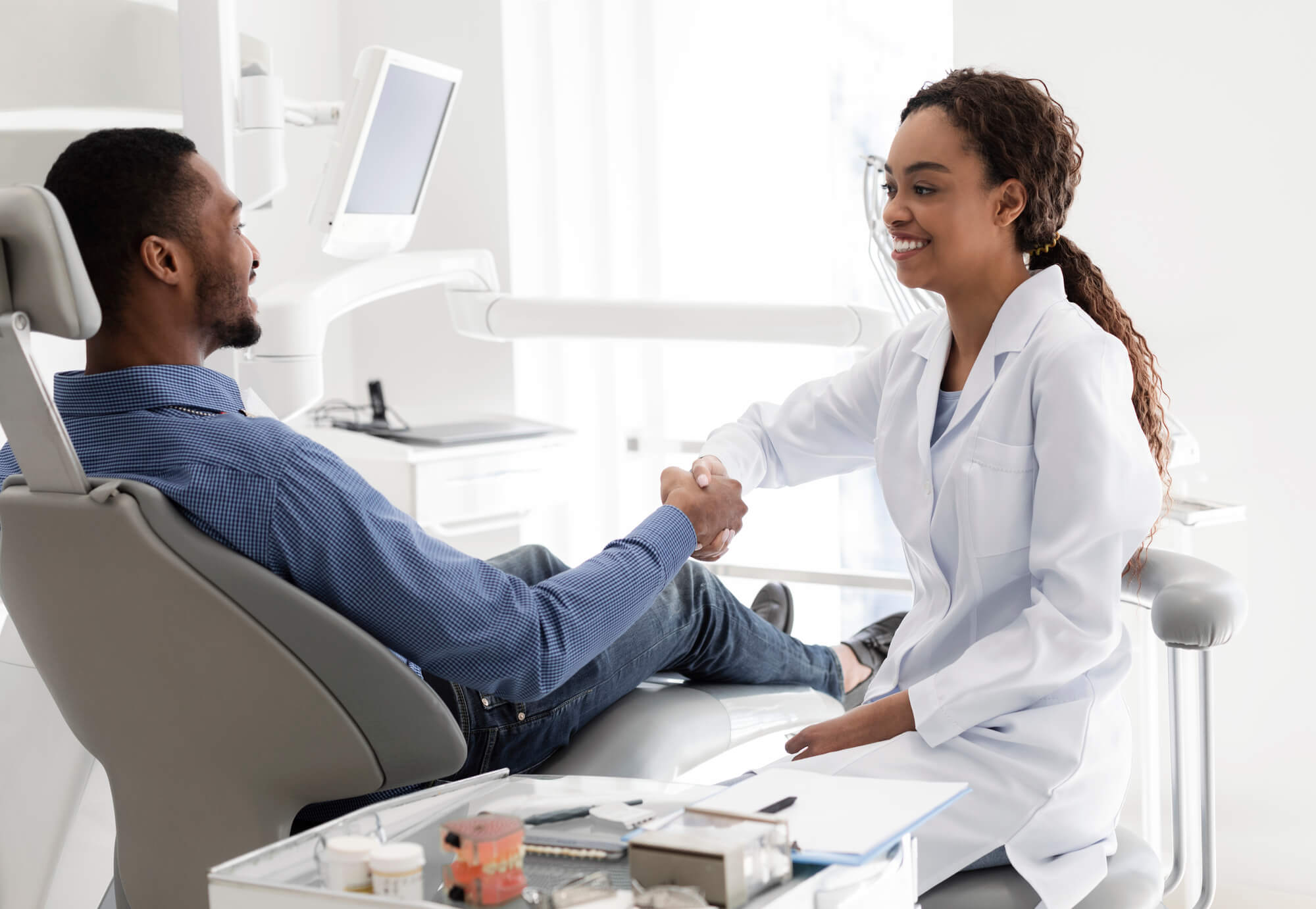 Summerfield Dentist and patient shake hands