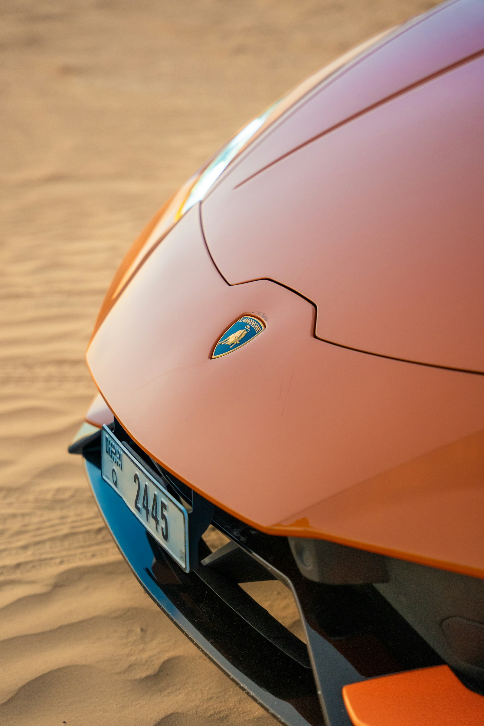 Lamborghini parked in the desert sand near Dubai