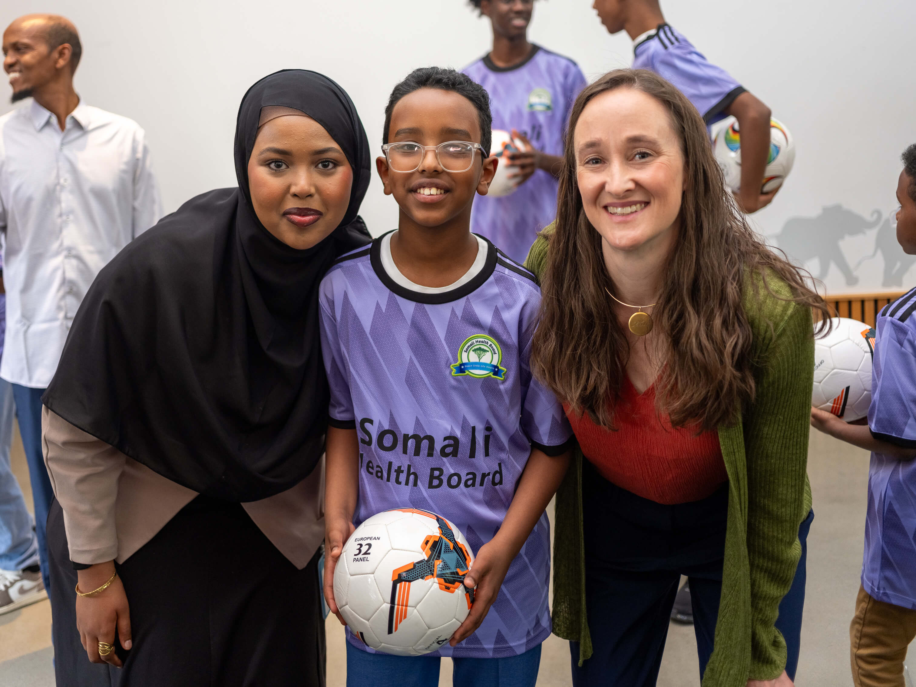 Seattle Mayor Katie B. Wilson with a youth and another female adult