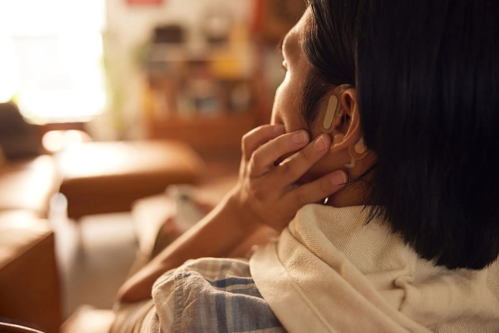 Man applying the Sparrow Ascent earpiece