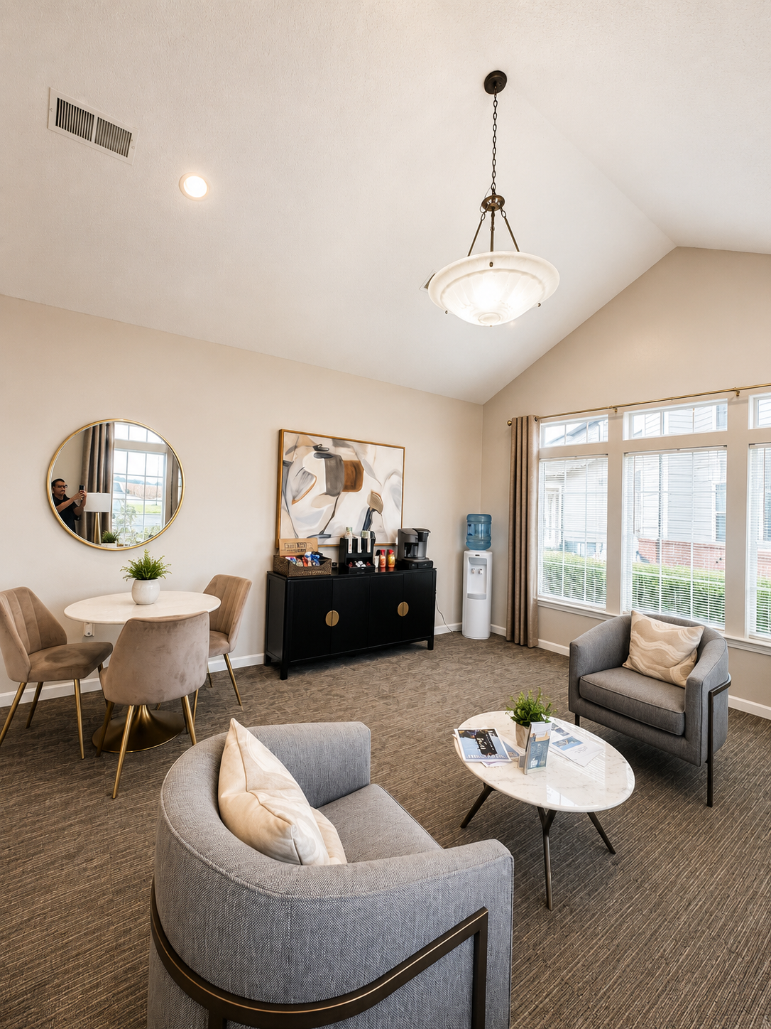 The office with seating area featuring table and chairs, sofas, and coffee bar