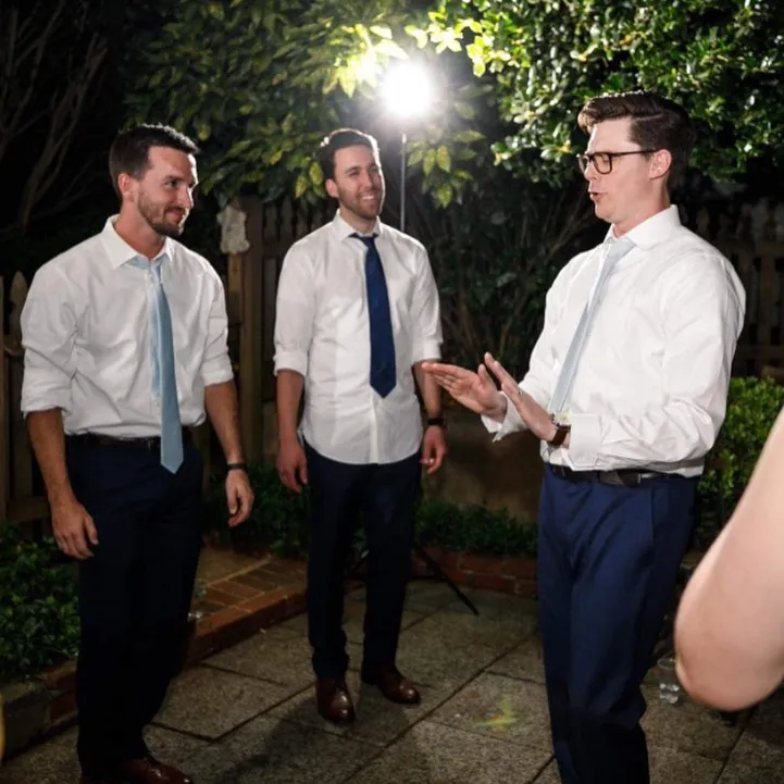 Old photo of the three founders of Peartree Web Development dancing at a wedding.