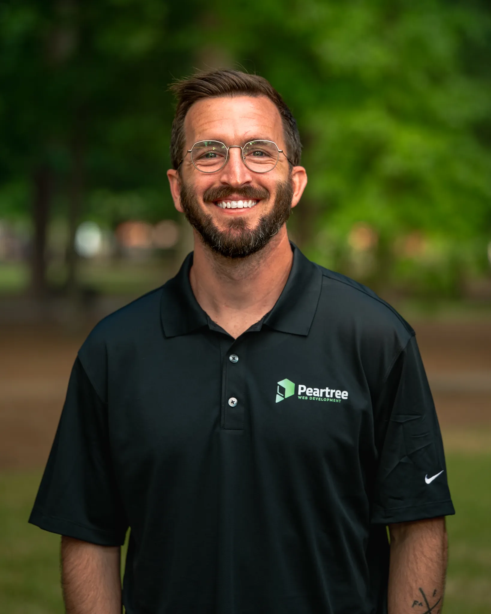 A headshot of Clinton Brothers, one of the founders of Peartree Web Development