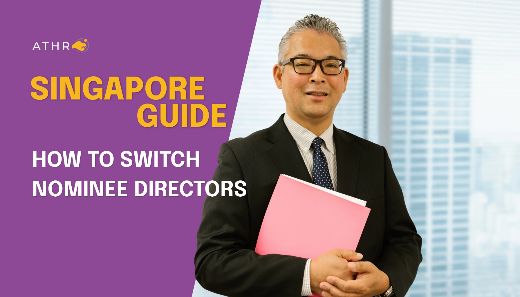 Confident businessman in a black suit holding a pink folder and smiling at the camera indoors while considering nominee director services in Singapore.