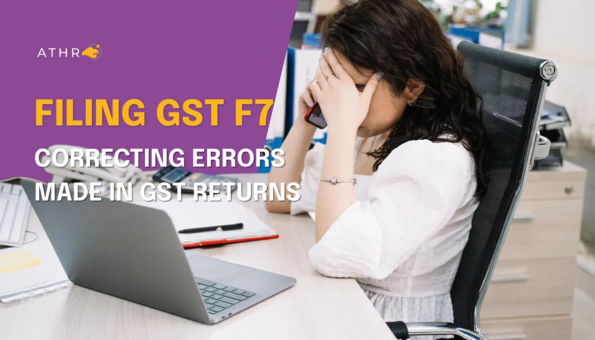 Businesswoman in an office sitting at a desk, visibly stressed after spotting an error in a GST return her company filed.