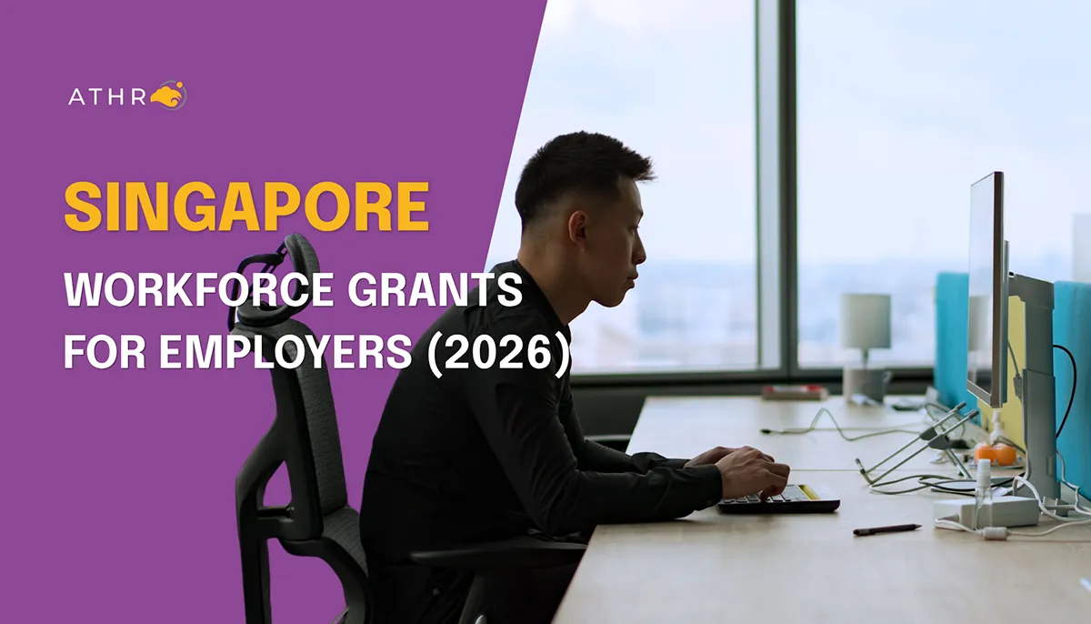 Asian man working on a computer in a contemporary office space in Singapore.