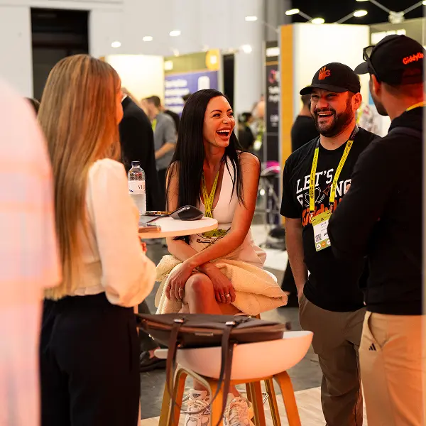 A group of people standing around a table.