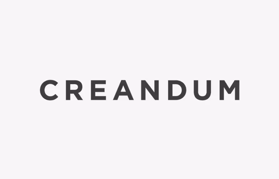 Text logo reading 'CREANDUM' in bold black uppercase letters on a light gray background.
