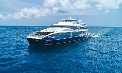 Front-side view of a Cat Cocos ferry cruising through the Indian Ocean near Seychelles, connecting Mahé, Praslin, and La Digue islands with SeyFerry.