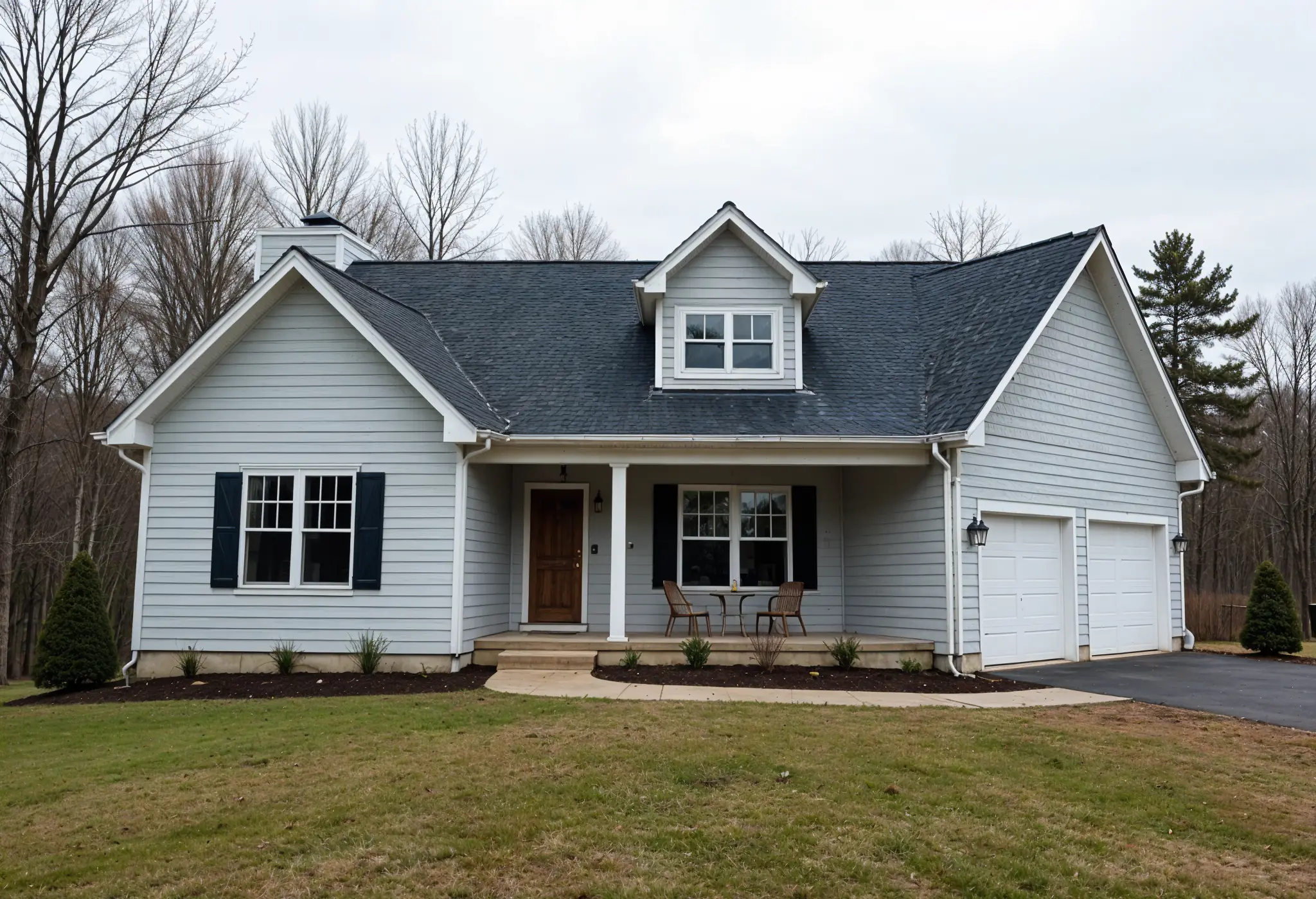 Single-story West Virginia home with gray fiber cement lap siding and forest backdrop.