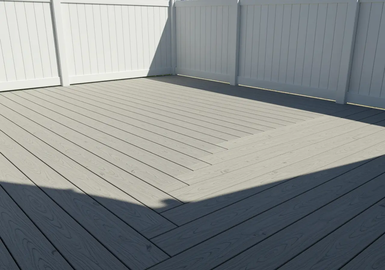 Light-gray composite deck with white vinyl fence in full sunlight, Norfolk, Virginia.