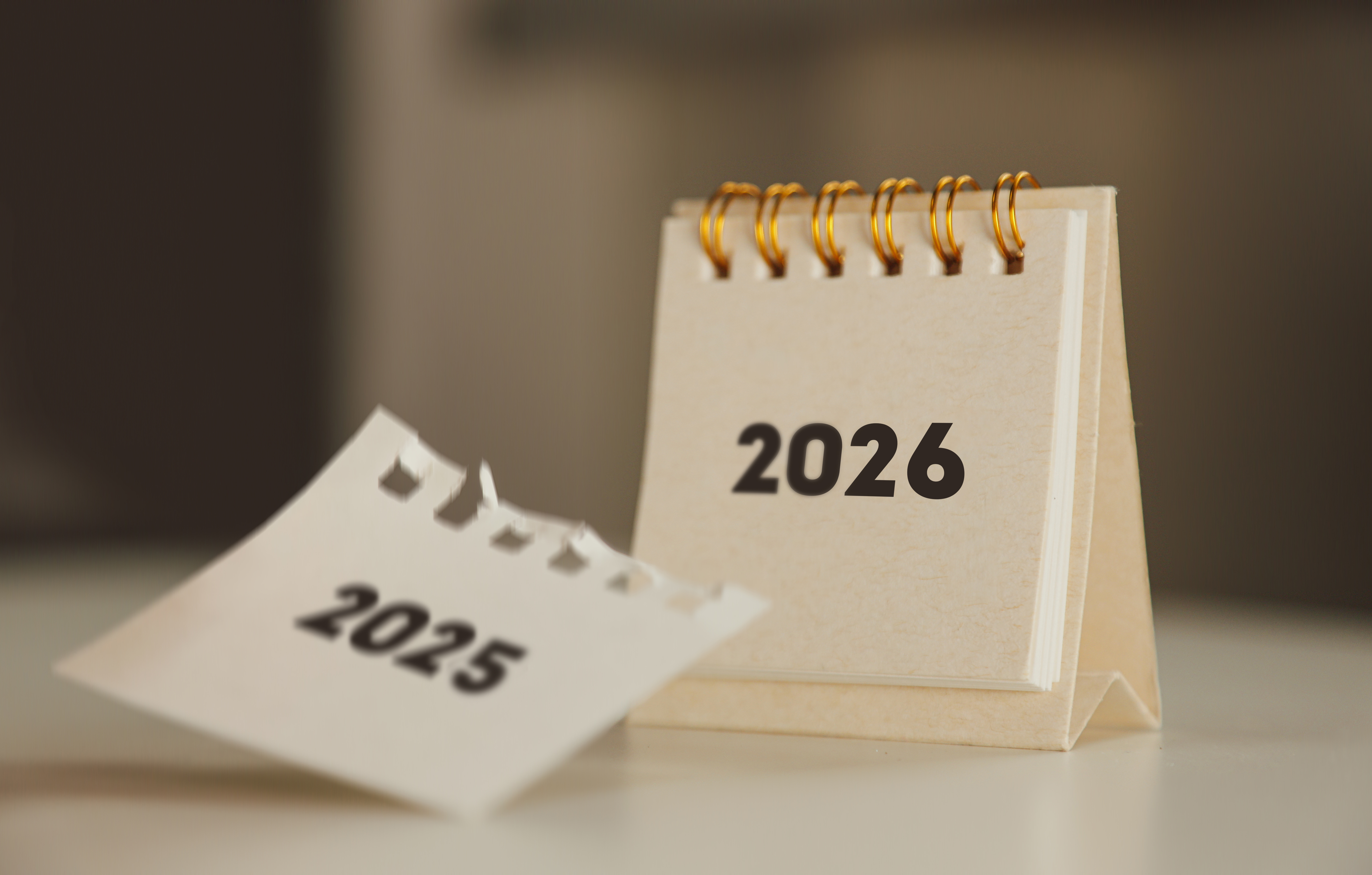 A calendar showing 2025 changing to 2026