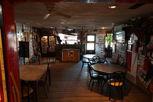 Young diverse couple having lunch with junk food
