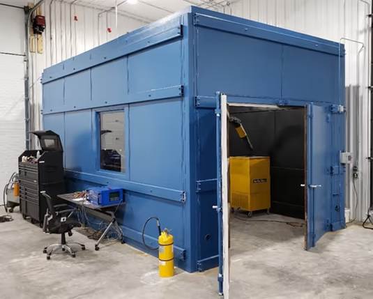 A blue building with a door openDescription automatically generated