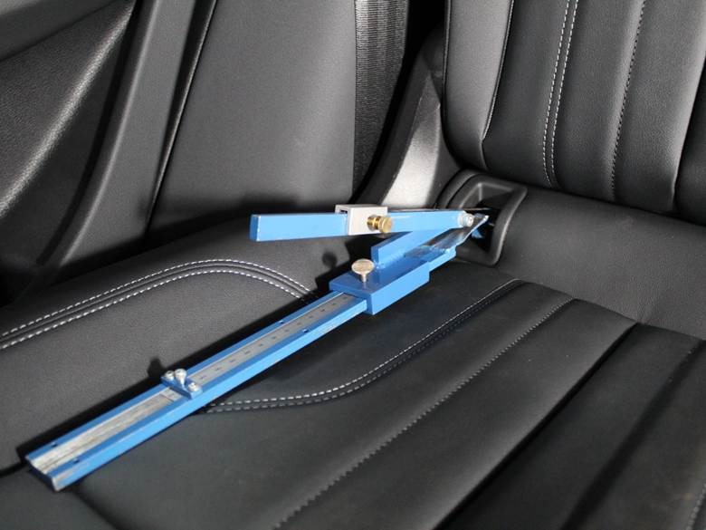 A blue ruler on a car seatAI-generated content may be incorrect.