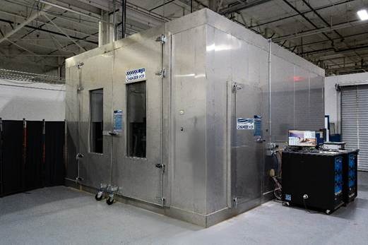 A large metal box in a factoryAI-generated content may be incorrect.