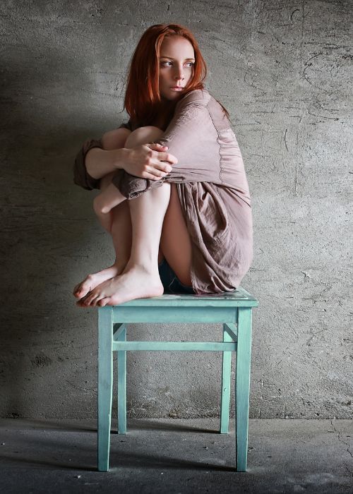 woman in trauma sitting on chair