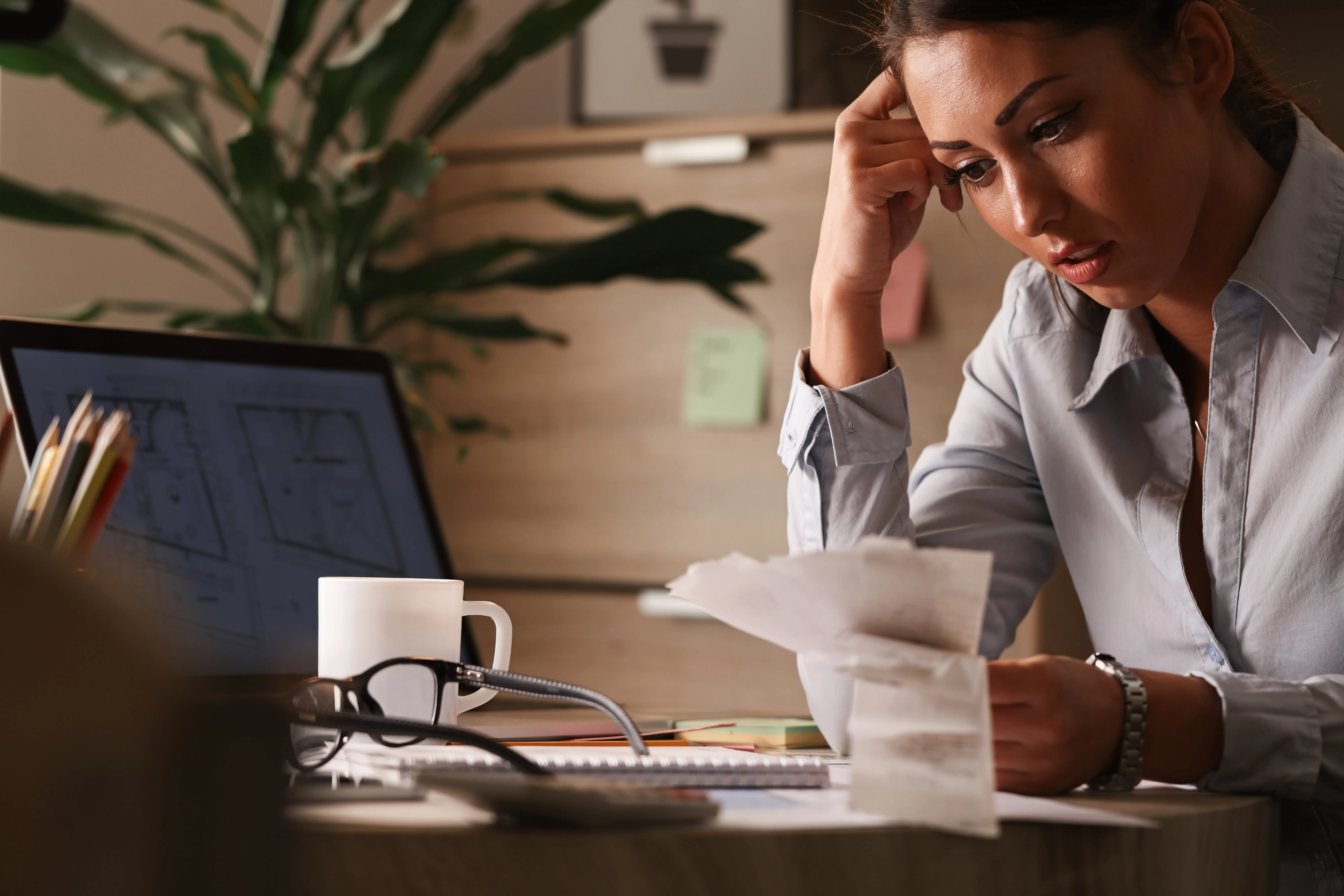 Person looking shocked at high utility bill