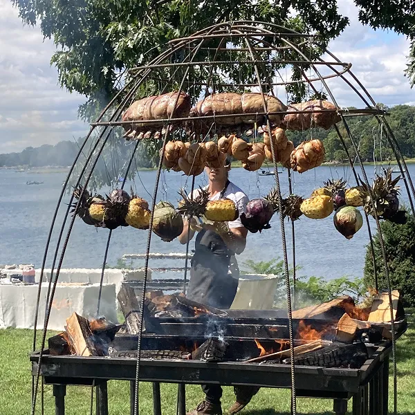 A grill specially built for an outdoor wedding by the chefs at Bartleby & Sage.