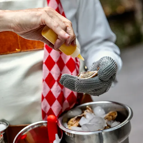 The chef of Bartleby & Sage shucking oysters.