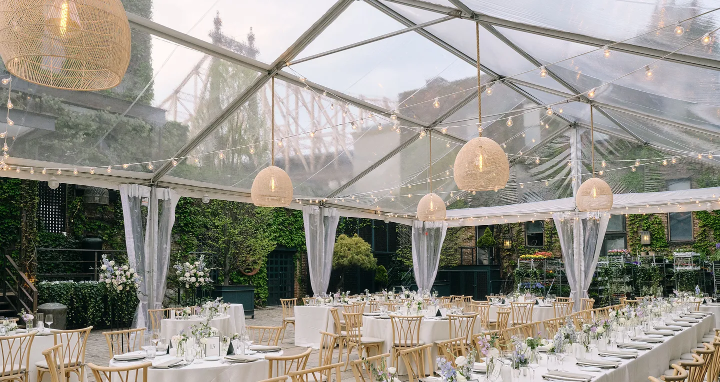 A wedding at 620 Loft, outside on a rooftop terrace that overlooks the Brooklyn Bridge. 