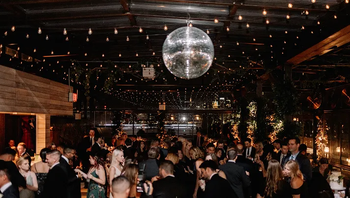 Private party at 74 Wythe with big dance floor and giant discoball.