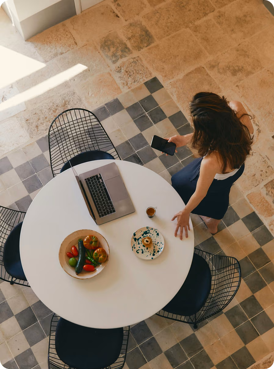 Woman near a table in a  beautiful house