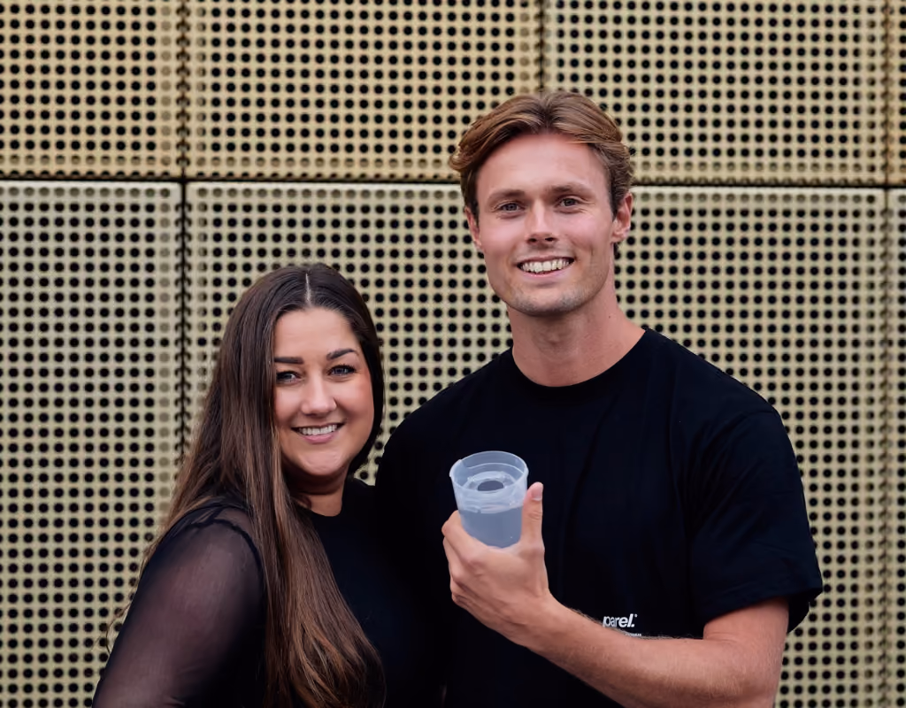 The founders of DrinkSaver posing with their product
