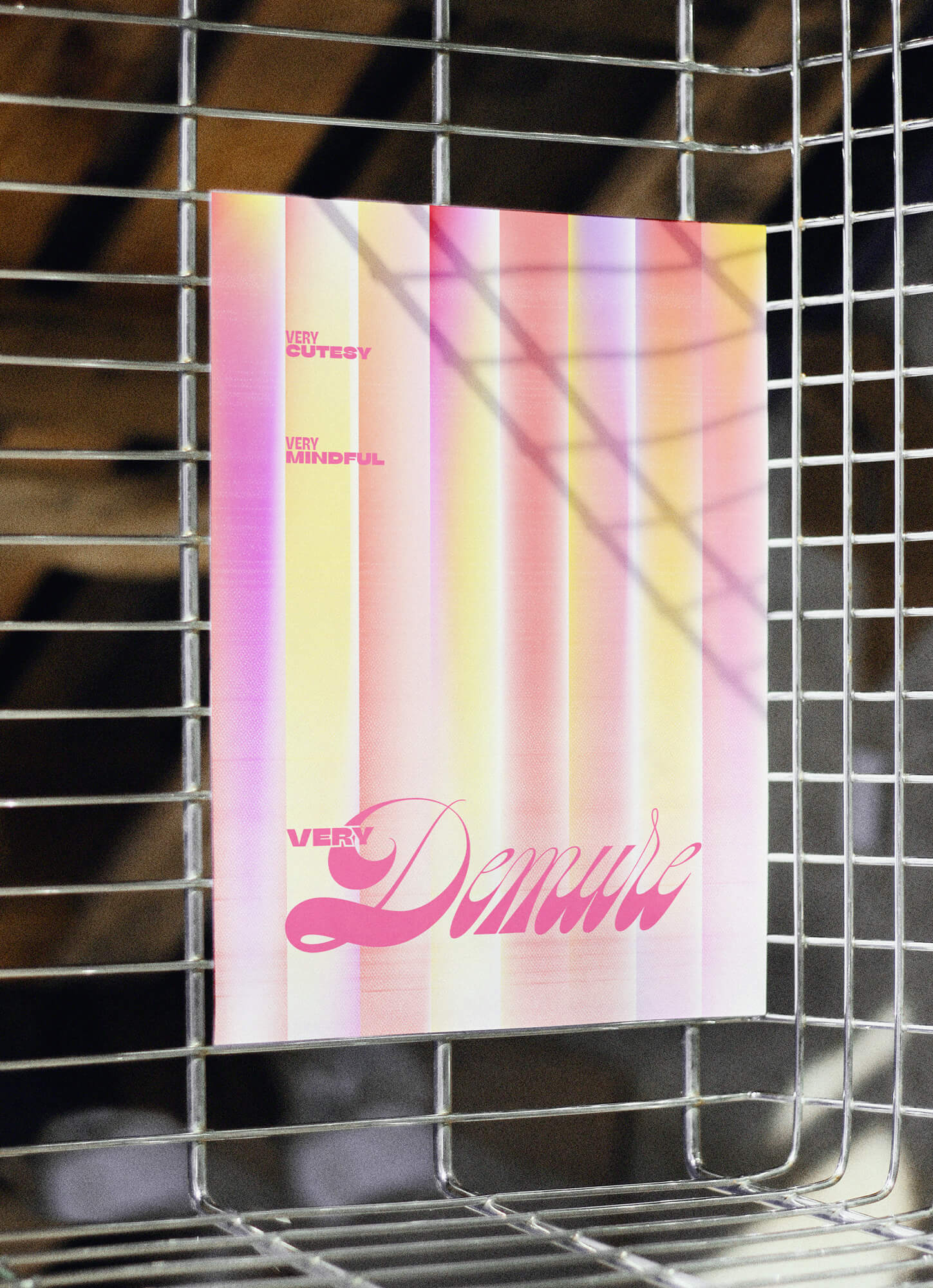 A print that says "Very cutesy, very mindful, very demure". The print is in gradients, with pink, yellow, and coral colours.