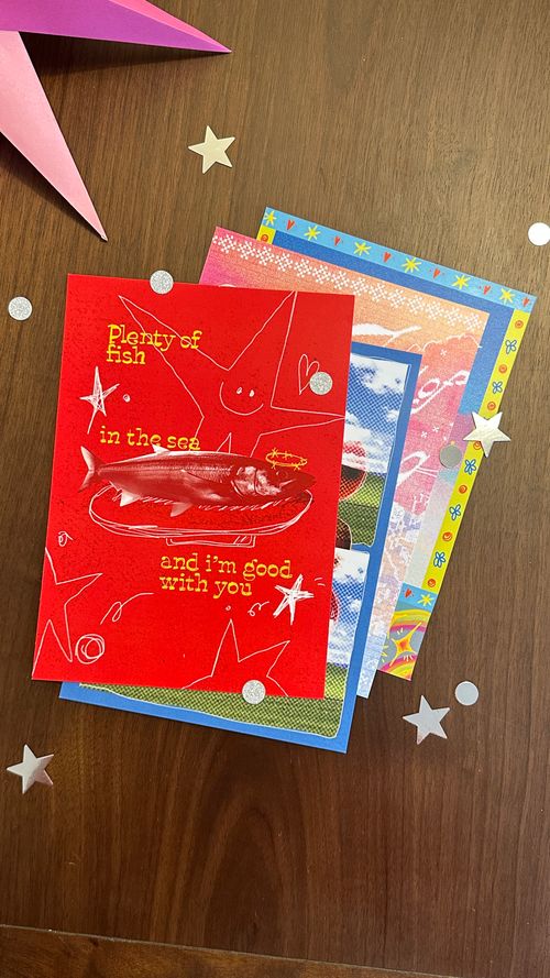 A stack of beautifully designed art prints from previous months of Morning Mail Club's mail