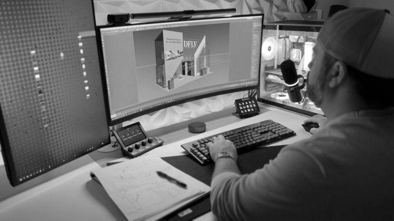 Design Factory Las Vegas exhibit designer reviewing custom trade show booth plans
