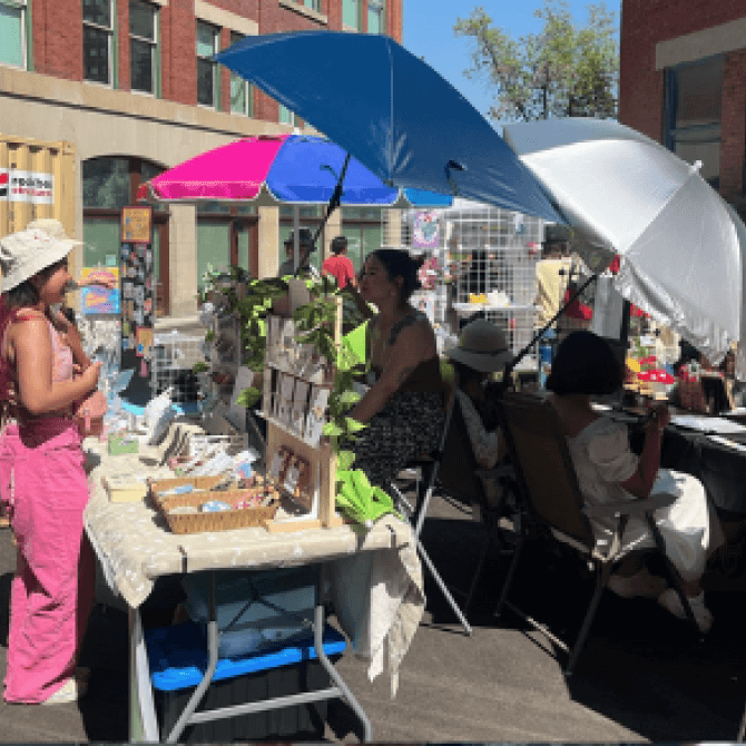Stalls at a busy craft market.